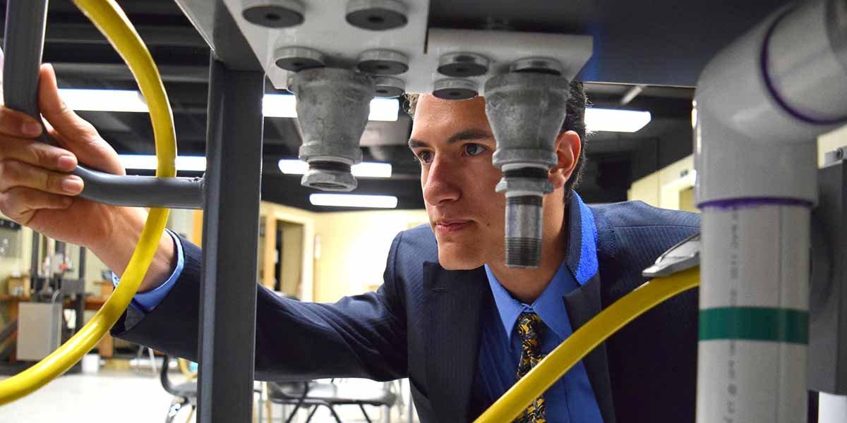 A student examines lab equipment